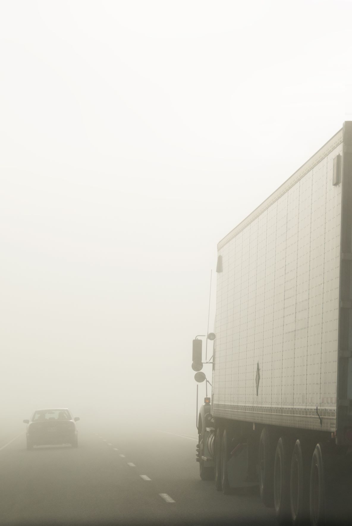 truck driving in fog