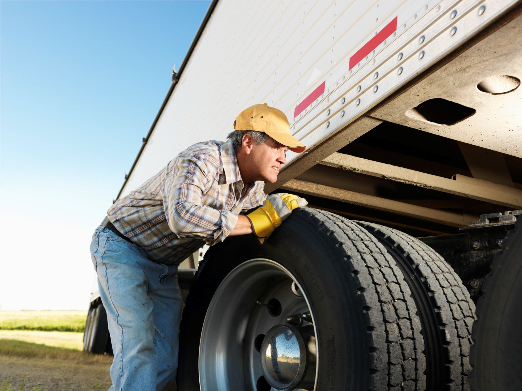 a man changing truck tires